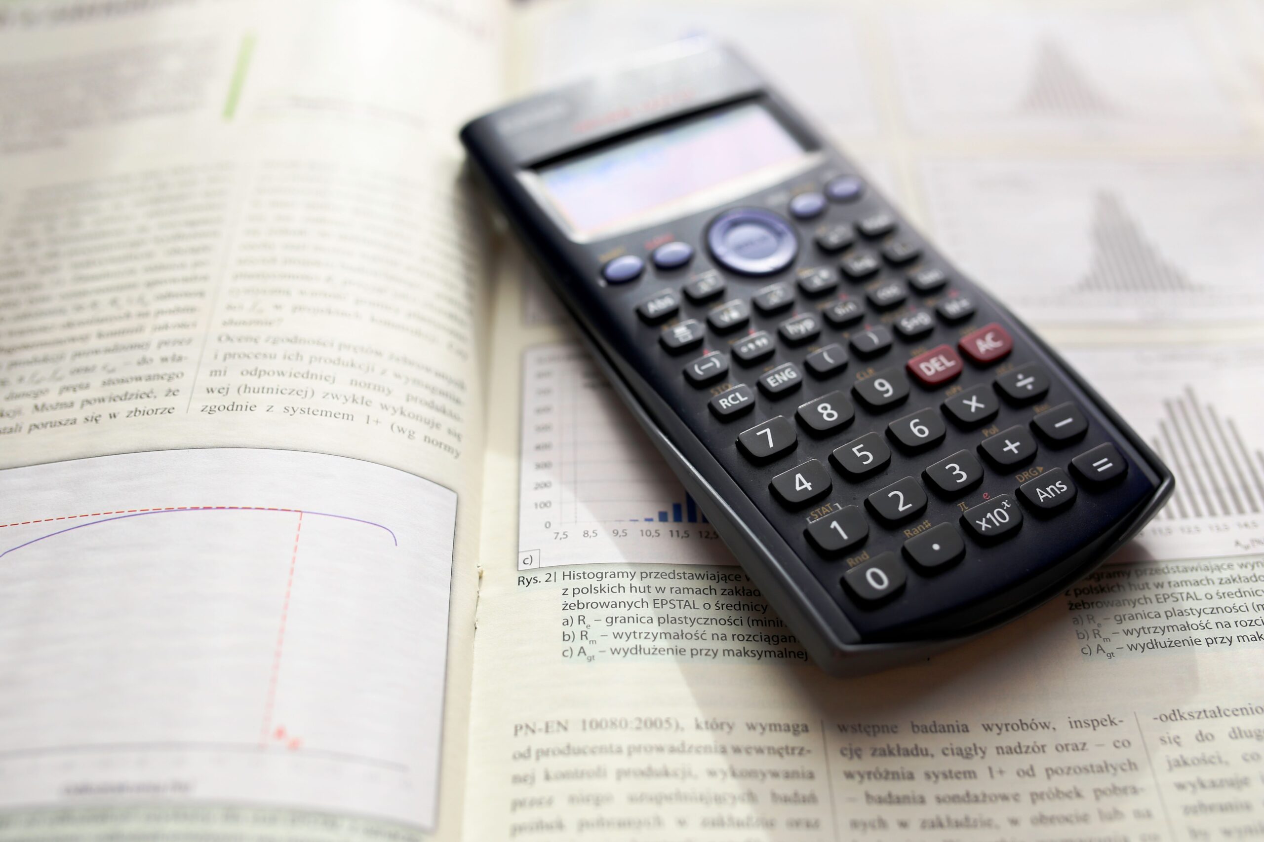 A scientific calculator on statistics notes used to calculate z-scores from a mean and standard deviation.