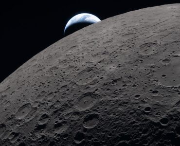 Crescent Earth setting beyond the Moon during the Artemis II lunar flyby