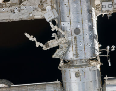 The International Space Station orbiting above Earth, where researchers study brain organoids in microgravity