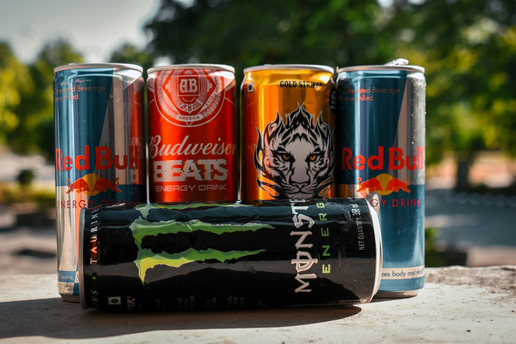 Several energy drink cans showing another common source of caffeine