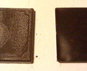 Two chocolate squares, one with a pale coating caused by fat bloom