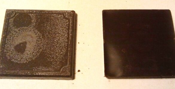 Two chocolate squares, one with a pale coating caused by fat bloom