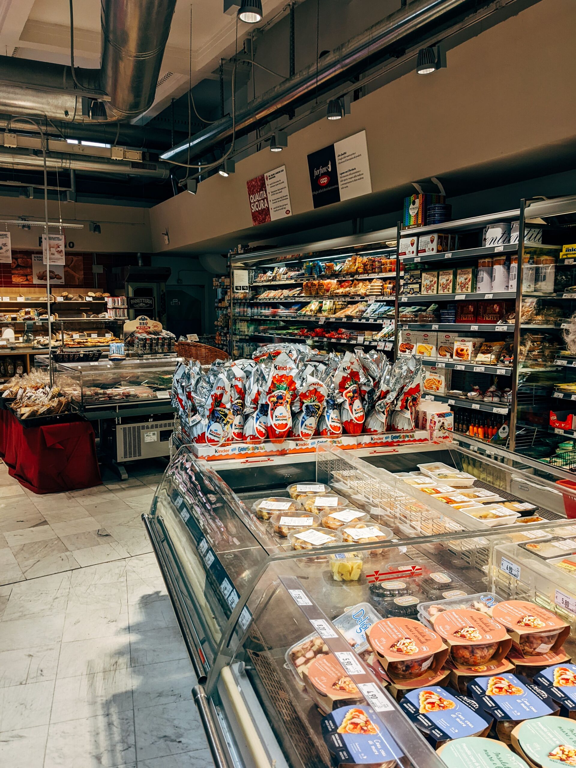 A supermarket aisle lined with packaged foods and household products