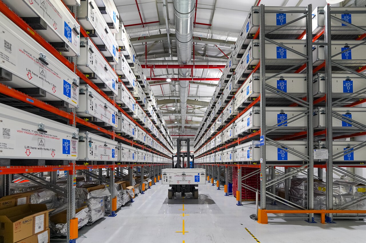 Rows of boxed mirror segments inside the ELT technical facility at Paranal