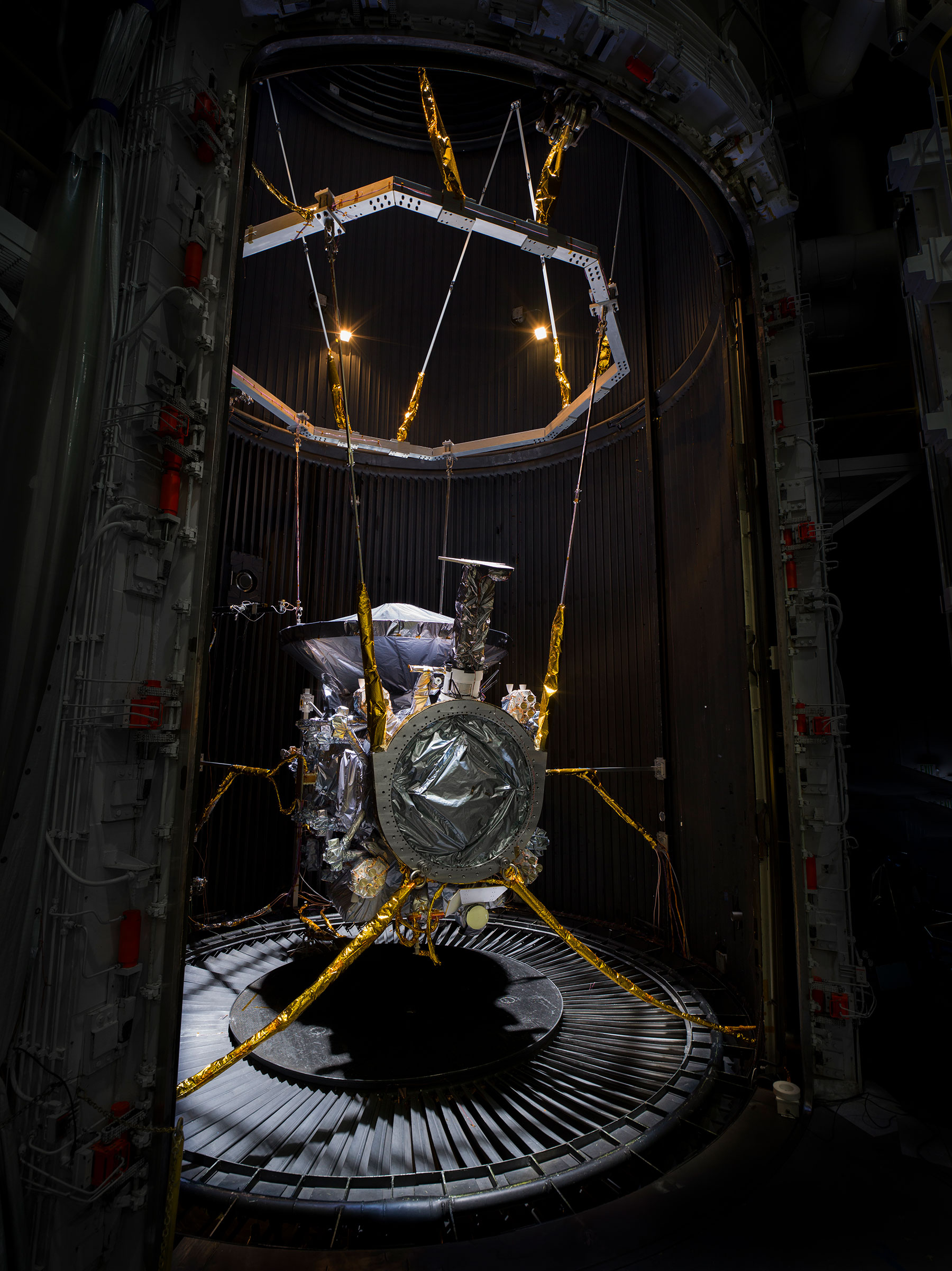 Europa Clipper spacecraft suspended inside a thermal vacuum chamber at NASA JPL