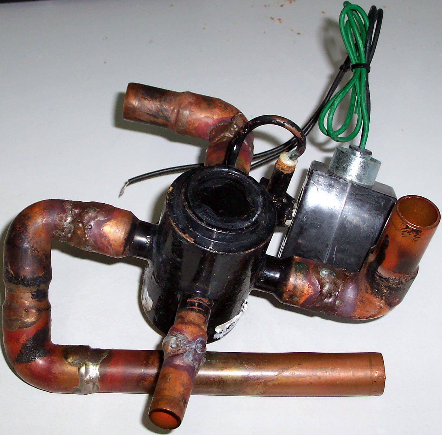 Reversing valve removed from an HVAC heat pump