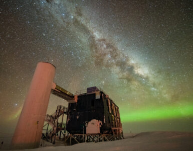 The IceCube Laboratory beneath a star-filled Antarctic sky at the South Pole.