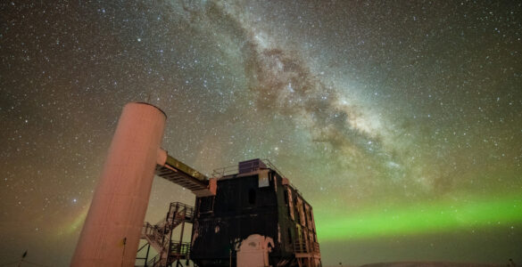 The IceCube Laboratory beneath a star-filled Antarctic sky at the South Pole.