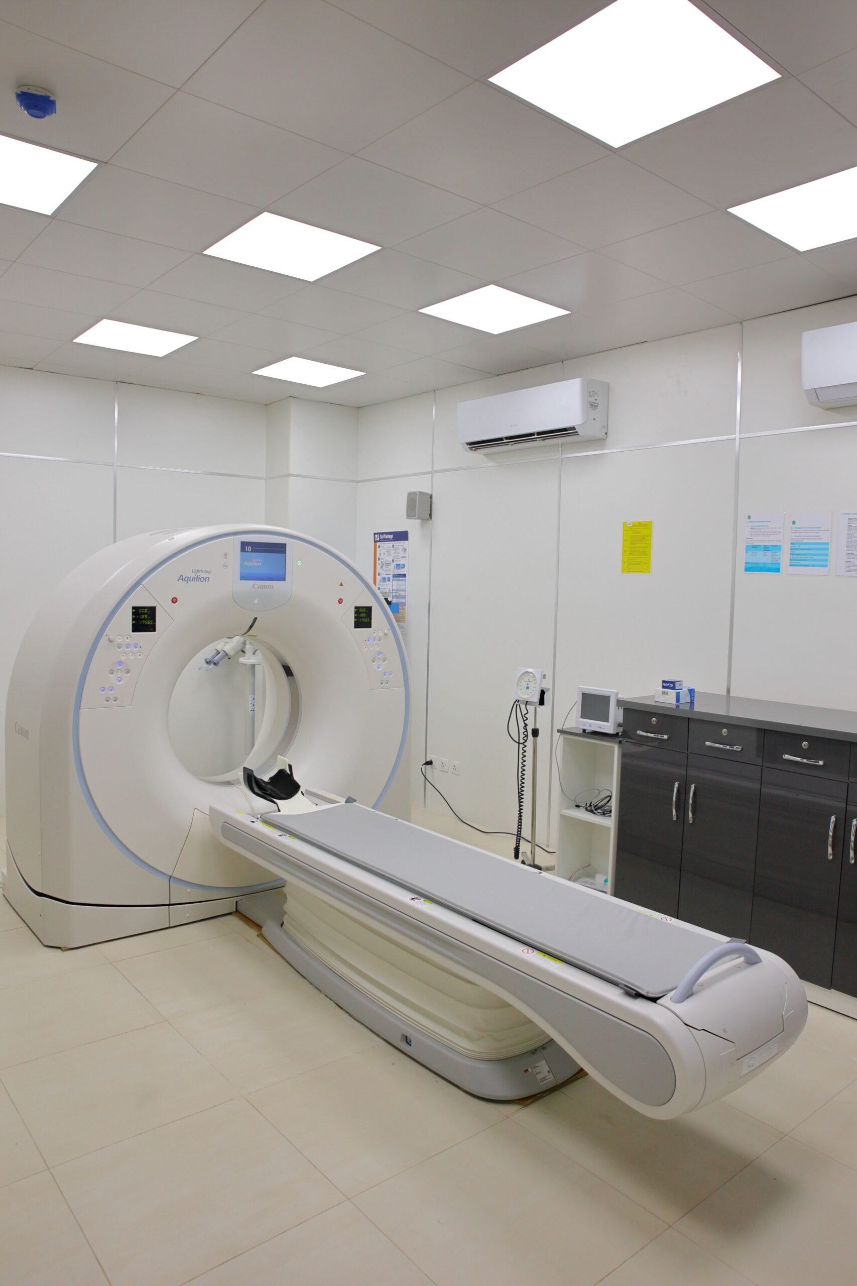 A modern medical scanner in a hospital imaging room