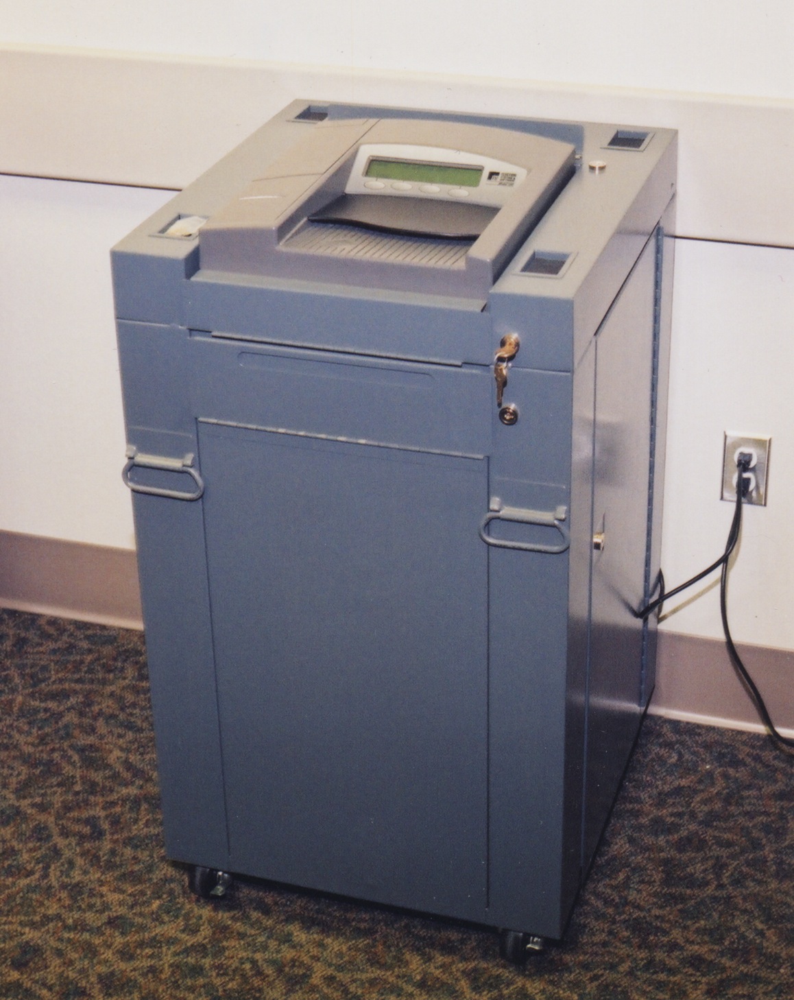 An optical ballot scanner mounted on a secure ballot box