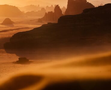 Red sandstone desert under a pale sky, used as an Earth analogue for Mars terrain