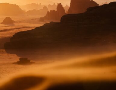 Red sandstone desert under a pale sky, used as an Earth analogue for Mars terrain