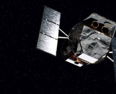 Artist's concept of NASA's Neil Gehrels Swift Observatory orbiting above Earth