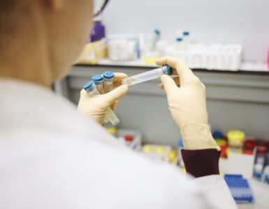 Scientist examining test tubes in a laboratory