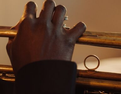 Close-up of a musician pressing the valves while playing a trumpet
