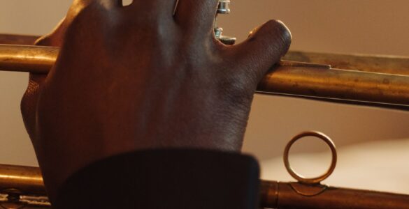 Close-up of a musician pressing the valves while playing a trumpet